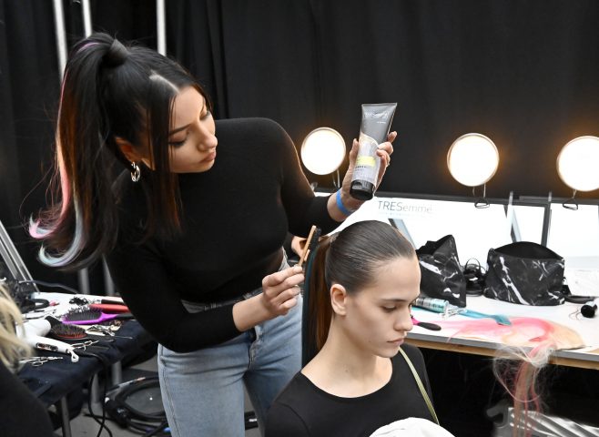 NEW YORK, NEW YORK - FEBRUARY 06: Justine Marjan and a model  prepare backstage at TRESemme x Christian Siriano show during NYFW on February 06, 2020 in New York City. (Photo by Astrid Stawiarz/Getty Images for TRESemme)